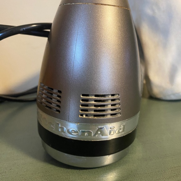 KitchenAid hand mixer with attachments.